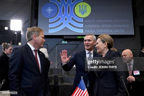 Britain's Defense Minister Grant Shapps, NATO Secretary General Jens Stoltenberg and US Permanent Representative to NATO Julianne Smith attend the...