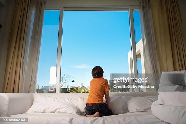 boy (9-11) looking out window, rear view - open day 11 bildbanksfoton och bilder