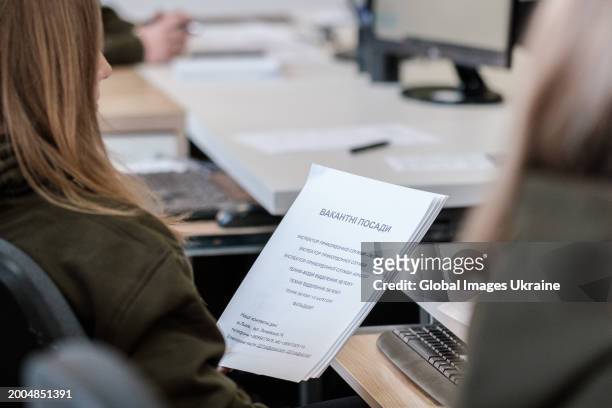 Worker of the recruiting centre of Ukrainian Army holds a list of vacancies during the opening of the centre on February 12, 2024 in Lviv, Ukraine....