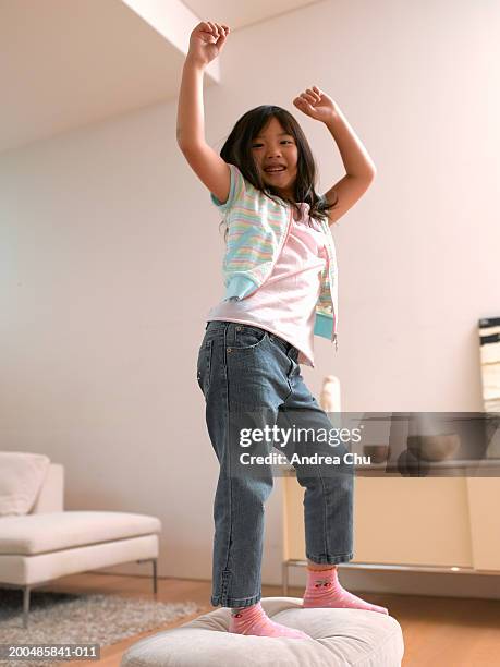 girl (5-7) dancing - girl black hair room stock pictures, royalty-free photos & images