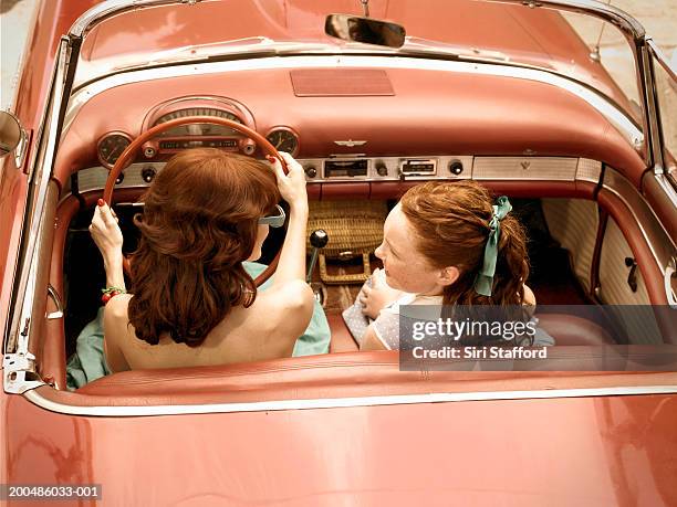 mother and daughter (12-14) riding in vintage car, elevated view - old car interior stock pictures, royalty-free photos & images