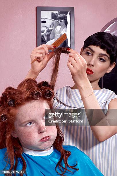 girl (10-12) having hair styled in beauty parlor - beauty parlor retro stock pictures, royalty-free photos & images
