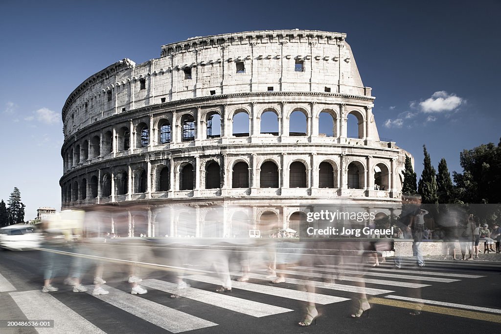 Italy, Lazio, Rome, Colosseum, pedestrian crossing (long exposure)