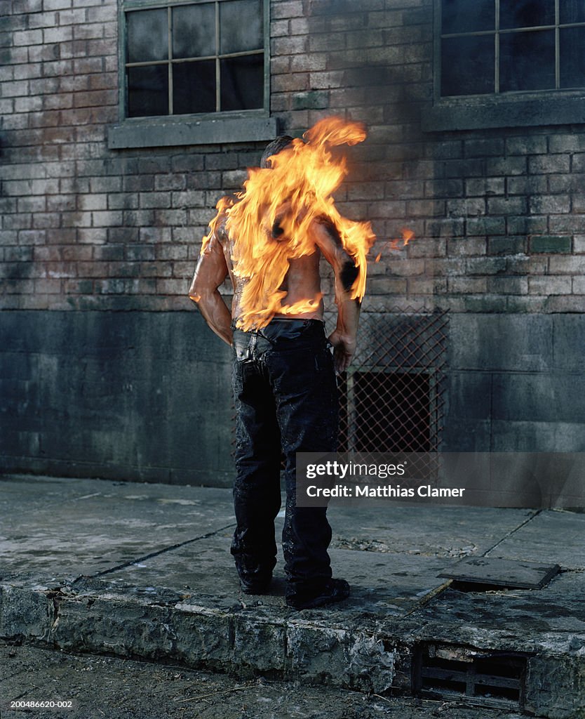 Man on fire, rear view