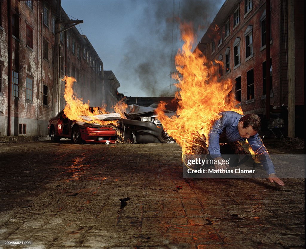Man on fire hurtling away from auto collision