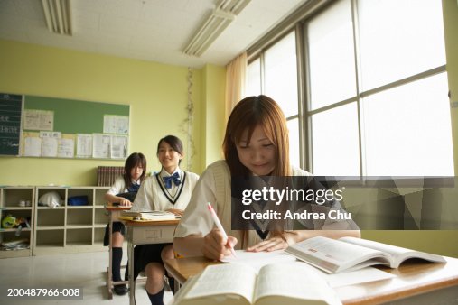 Teenage Female Students Doing Lessons In Class High-Res Stock Photo ...