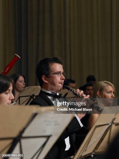 flautist and oboe player performing in orchestra - oboe stock pictures, royalty-free photos & images