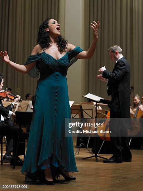 female singer performing with orchestra - music stand stock pictures, royalty-free photos & images