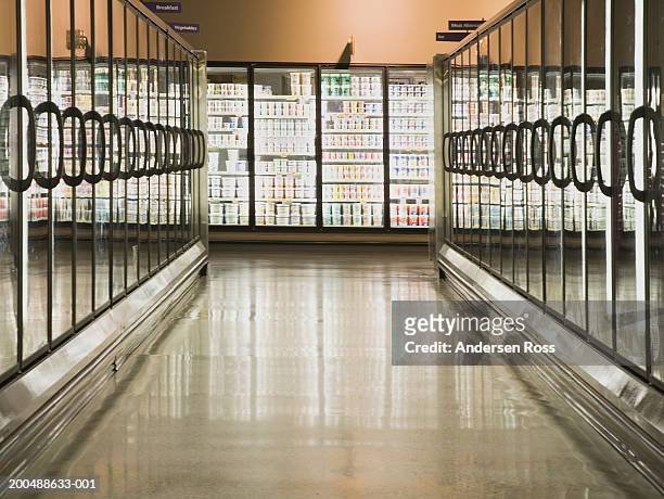 frozen food aisle in grocery store - supermarket refrigeration stock-fotos und bilder