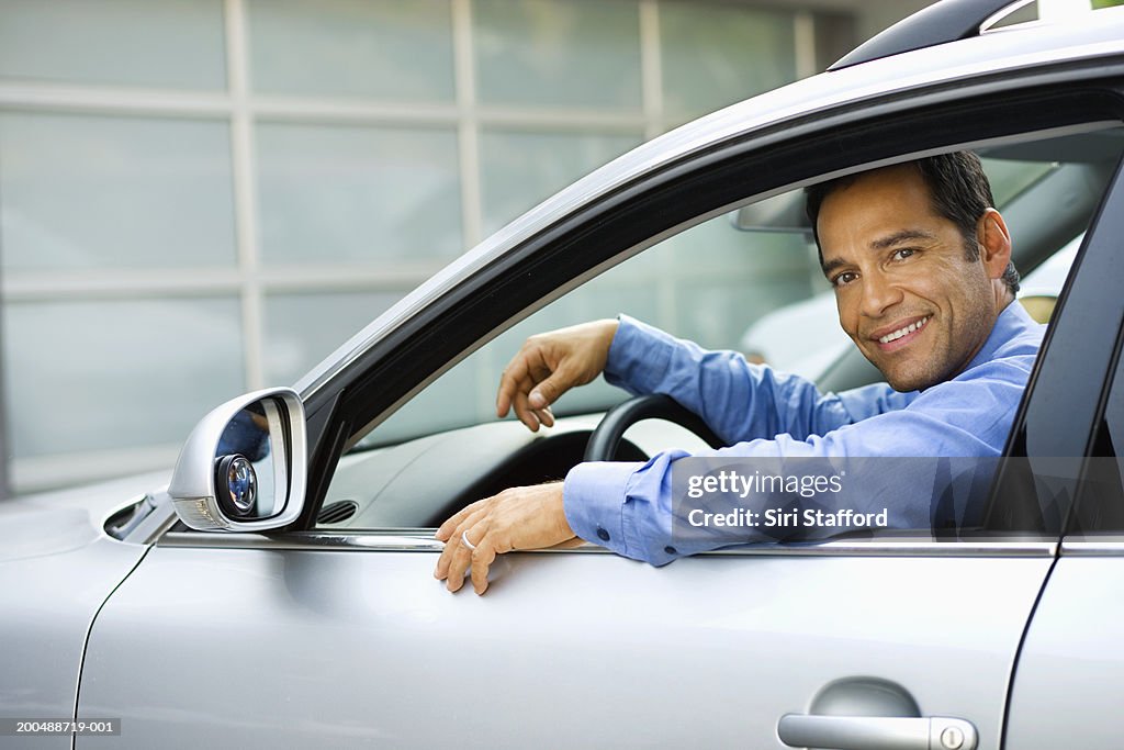 Businessman sitting in car