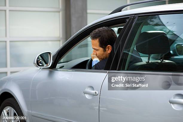 businessman backing out car - reverse stock pictures, royalty-free photos & images