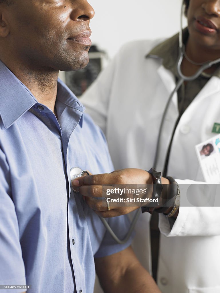 Female doctor examining patient