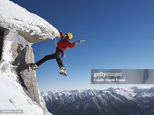 austria, tirol, mountaineer with ice pick ascending hintertux glacier - winter sport fotografías e imágenes de stock