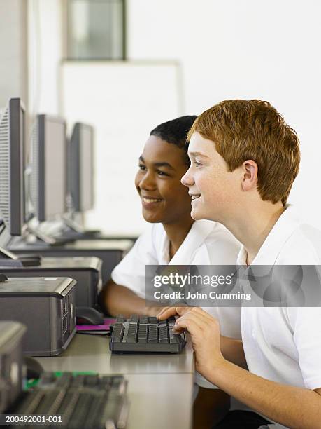 Students Standing Using Computer Images Students Using Computers In Class Side View Photo - Getty Images
