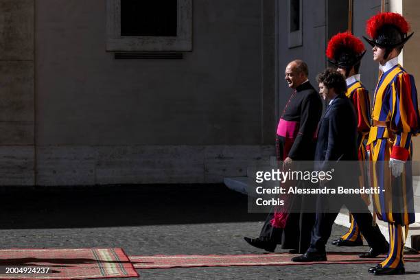 Argentina's President Javier Milei exits the Vatican Apostolic Palace flanked by Monsignor Guillermo Karcher, following a meeting with Pope Francis,...
