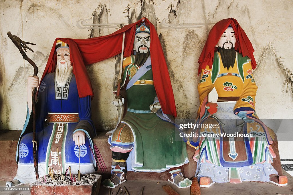 China, Shaanxi Province, Qinling Mountains, three statues side by side