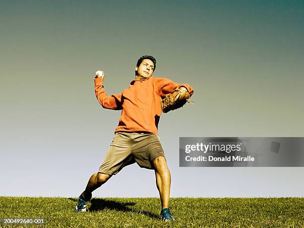 man throwing baseball - baseball thrower stock pictures, royalty-free photos & images