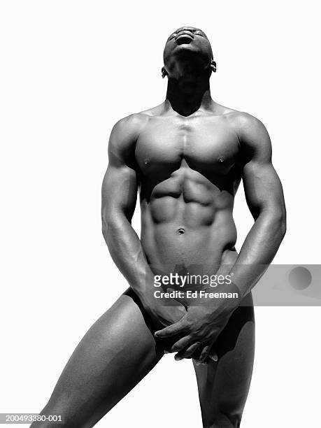 naked young man covering groin (b&w) - male crotch stock pictures, royalty-free photos & images