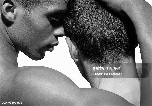two naked young men embracing, close-up (b&w) - nu imagens e fotografias de stock