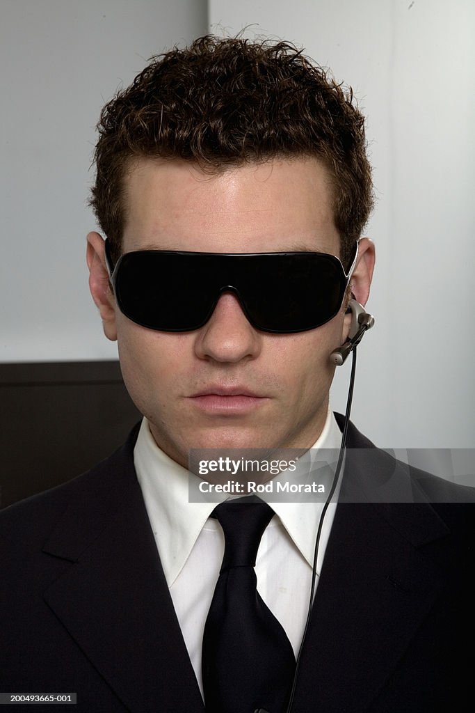 https://media.gettyimages.com/id/200493665-001/photo/businessman-wearing-dark-glasses-and-hands-free-mobile-phone-device.jpg?s=1024x1024&w=gi&k=20&c=JEW1pXe45nwO1-x1NmZ3i-Pe0fG9fJVYaDdFH479FSk=