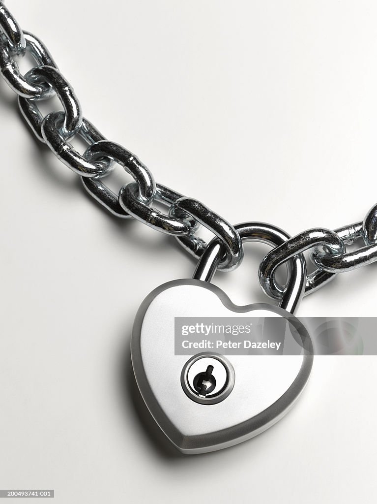 Heart shaped padlock on chain, close-up