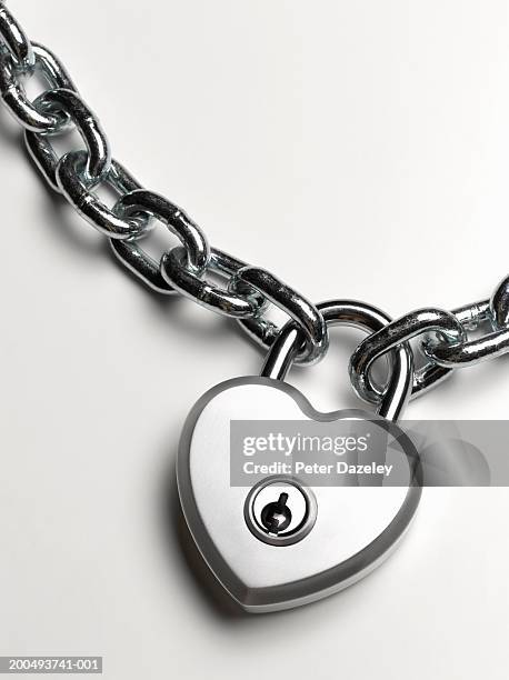 heart shaped padlock on chain, close-up - padlock chain stock pictures, royalty-free photos & images