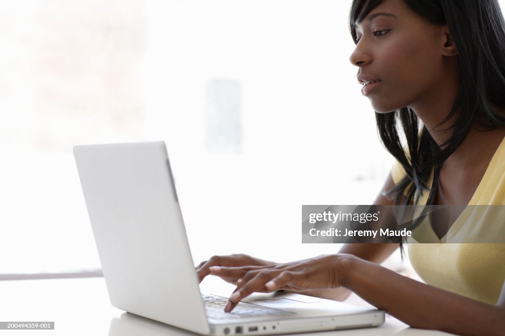 Young woman using laptop computer