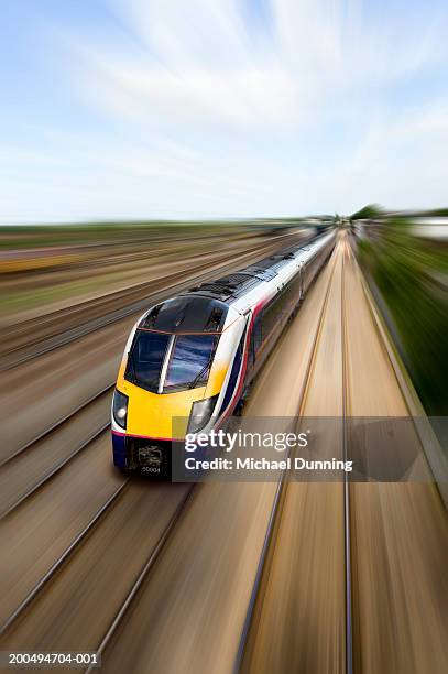 train, elevated view (blurred motion) - train uk stock pictures, royalty-free photos & images