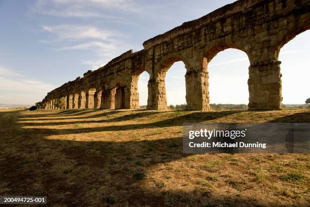 italy, rome, appian way, arches and shadows, outdoors - olden foto e immagini stock