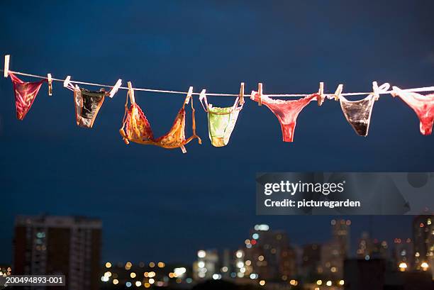 women's underwear hanging on line, night - tanga - fotografias e filmes do acervo