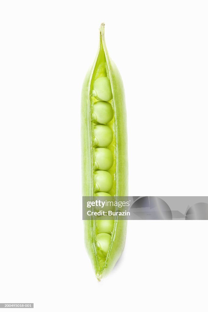 Peas in pod, against white background, close-up