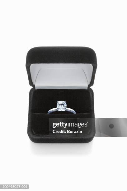 diamond ring in box, against white background, close-up - engagement ring foto e immagini stock