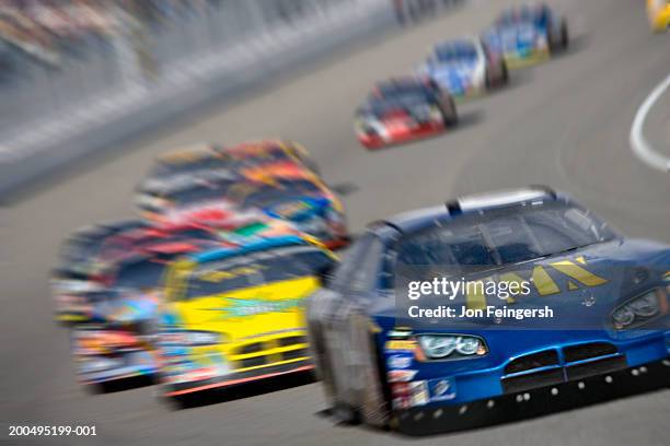 stock car race (digital composite, digital enhancement) - nascar blue flag stock pictures, royalty-free photos & images