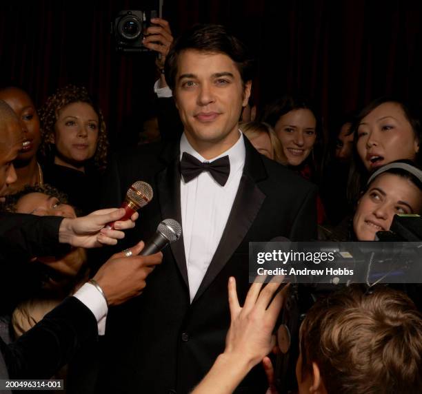 celebrity male in tuxedo talking to fans and media at event, portrait - fan of his work stock pictures, royalty-free photos & images