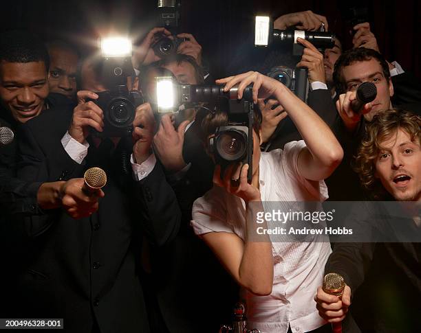 paparazzi photographers and television reporters at celebrity event - celebrità foto e immagini stock