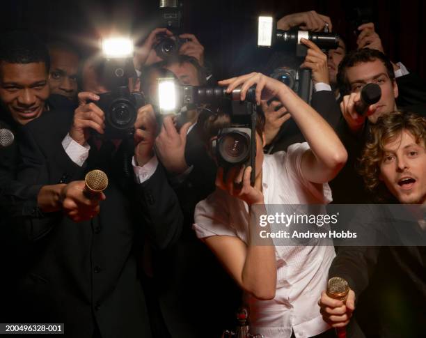 paparazzi photographers and television reporters at celebrity event - media portraits stock pictures, royalty-free photos & images