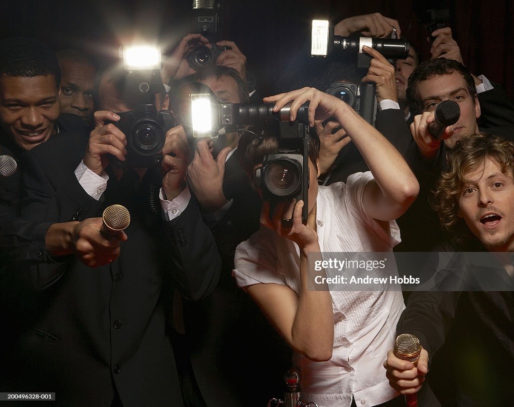 Paparazzi photographers and television reporters at celebrity event