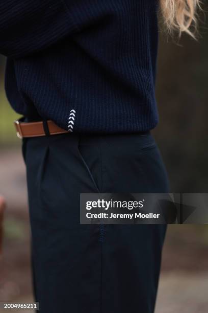 Britta Becker seen wearing Twelve by Britta Becker navy blue wool knit sweater, Hermès brown leather belt, Twelve by Britta Becker navy blue suit...