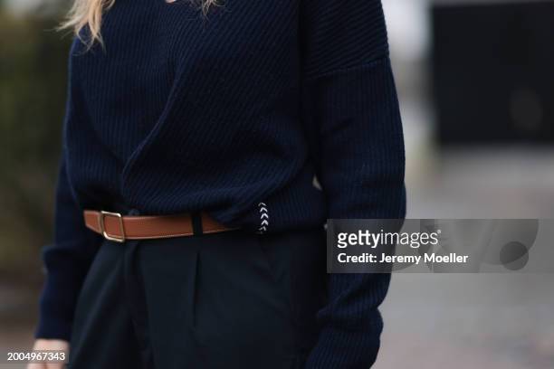 Britta Becker seen wearing Twelve by Britta Becker navy blue wool knit sweater, Hermès brown leather belt, Twelve by Britta Becker navy blue suit...