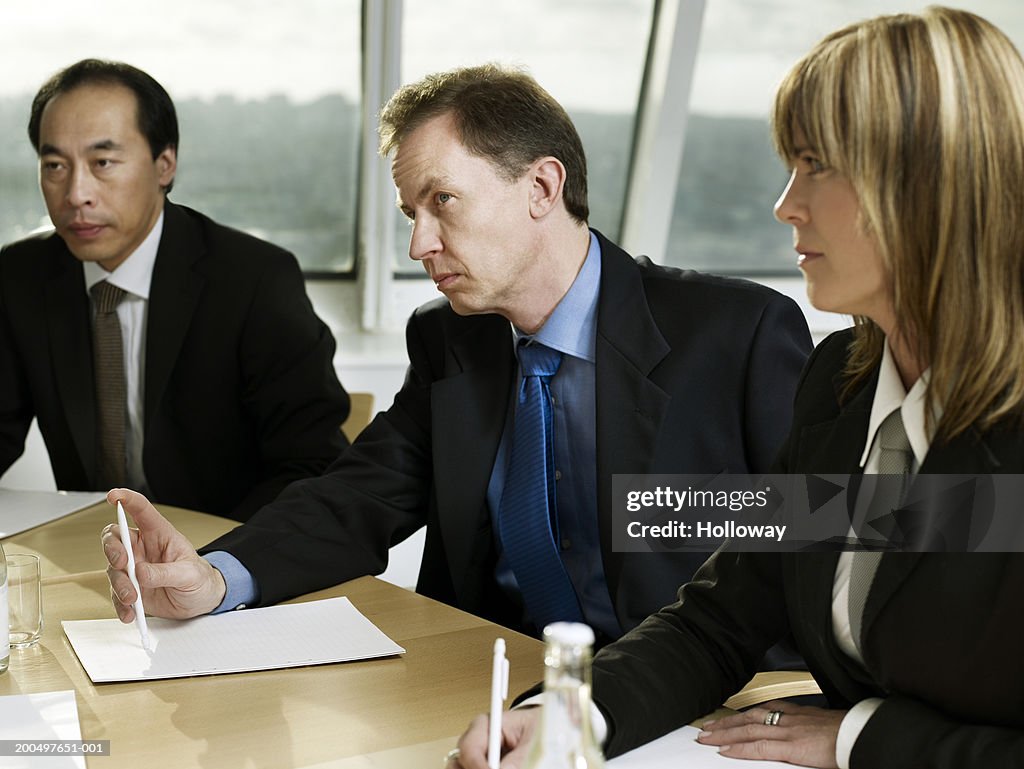 Business colleagues in meeting round conference table
