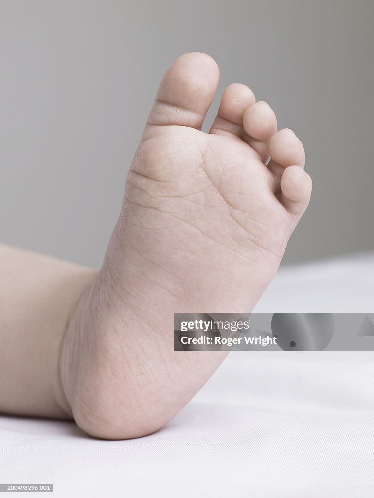 Baby girl (6-9 months), close-up of foot