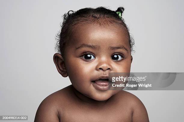 baby girl  (6-9 months) smiling, portrait - baby girls ストックフォトと画像
