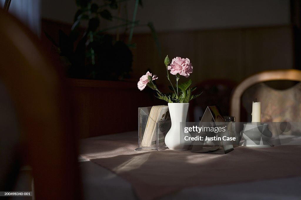 Flowers in vase on restaurant table