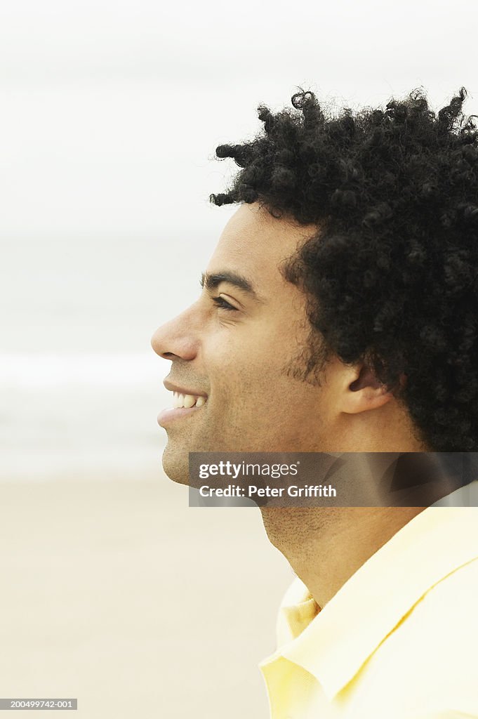 Man smiling, close-up, profile