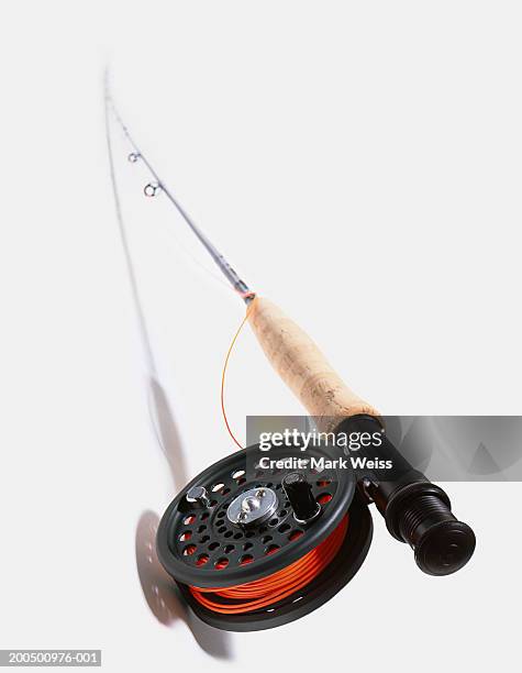 fishing rod and reel with red line - fishing pole stock pictures, royalty-free photos & images