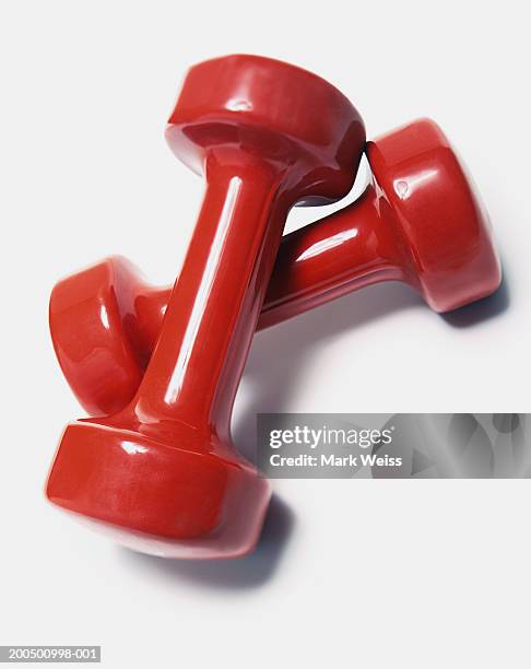 red dumbbells - dumbbell stock pictures, royalty-free photos & images