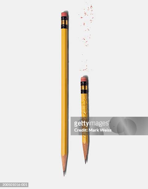 long sharp pencil and short chewed pencil - pencil stock pictures, royalty-free photos & images