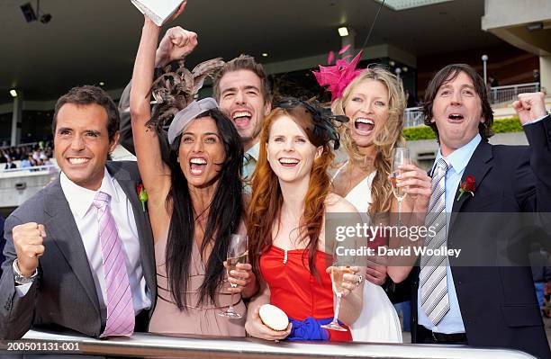 group of friends at the races, cheering - fascinator stock pictures, royalty-free photos & images