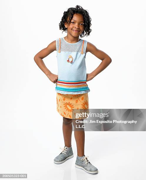 girl (5-7) with hands on hips, portrait - young girl white background stock pictures, royalty-free photos & images