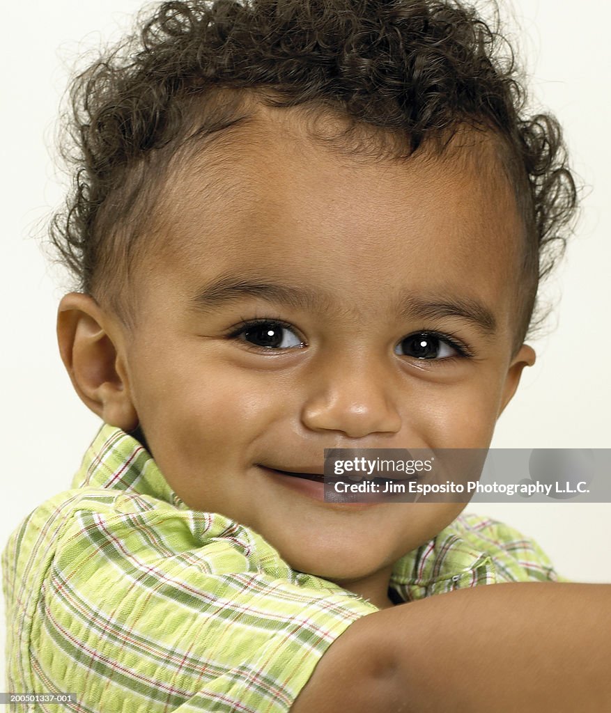 Male toddler (18-21 months) smiling, close-up